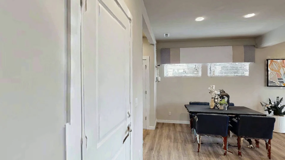 A hallway leading to a living room, long after the reading corner has left view.